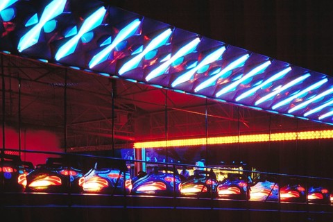 Illuminated bumper cars at night, New Jersey, USA