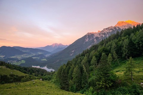 Magical sunset with alpenglow at the Halsalm above Hintersee with views of Hoher Göll and