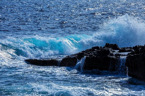 Rugged rocky coastline and foaming spray, on Stecci beach, near Capoliveri, Elba Island, Tuscan