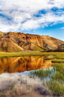 Volcanic landscape, colourful rhyolite mountains, water, Landmannalaugar, remote hiking area in