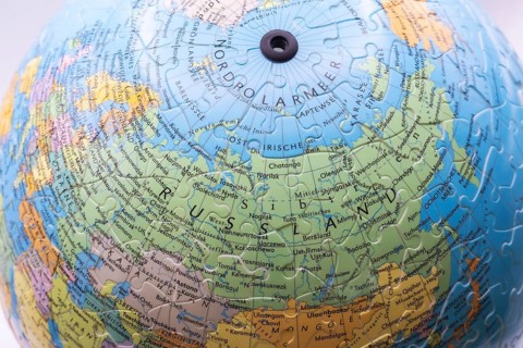 Puzzle globe. Map made from puzzle pieces. Russia