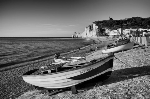 Rowing boat, boats lying on the beach, pebble beach, rock arch Falaise or Porte d'Amont, church