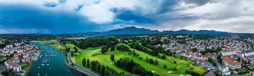 Panorama of Sunset and storm clouds over Pyrenees and Saint-Jean-de-Luz from a drone,