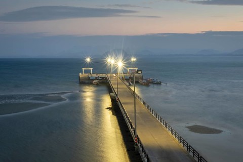 Illuminated jetty at night, harbour at Sivalai Beach, Koh Mook Island, Satun Province, Southern
