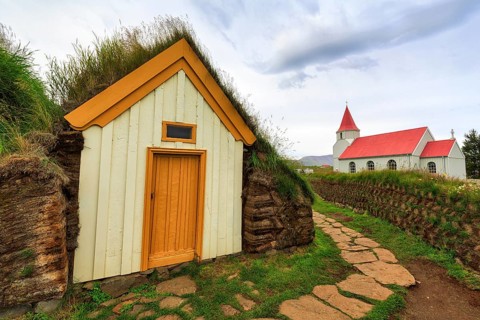 Grass sod houses and church, green roofs, peat farm or peat museum Glaumbaer or Glaumbær, open-air
