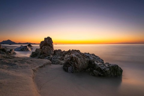 The sun rises on the Costa Rei, a stretch of coastline on the Italian Mediterranean island of