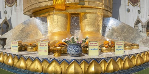 Feet of a 32 metre high standing Buddha decorated with glass mosaics and 24 carat gold, Luang Pho