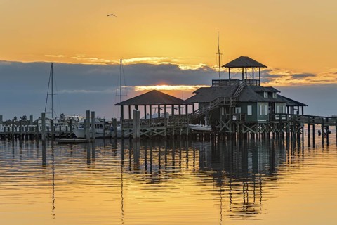 Biloxi Schooner Pier Complex at sunset on the Gulf of Mexico at Biloxi, Mississippi, USA