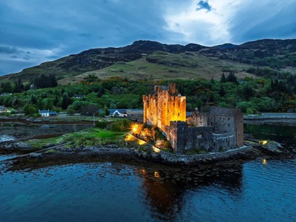 Night over Eilean Donan Castle and Loch Duich from a drone, Isle of Skye, Highlands, Scotland,