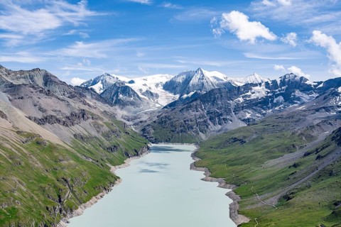 Blue mountain lake in a mountain landscape with glaciers, Lac des Dix reservoir and Mont Blanc de