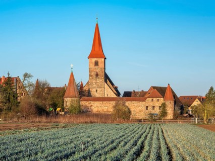 The medieval fortified church of St. George in the district of Kraftshof, Nuremberg, Middle