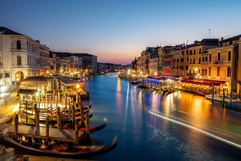 View of the Grand Canal at the blue hour, picturesque evening mood with illuminated palazzos on the