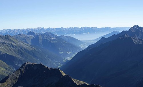 View of the Stubai Valley, mountain silhouettes, from the summit of the Wilder Freiger, Stubai