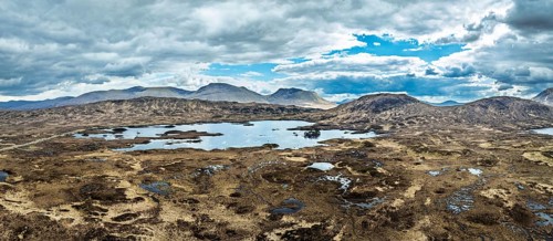 Panorama of Rannoch Moor from a drone over Loch Ba and Loch of the Armpit, A82 Highland Way, Argyll