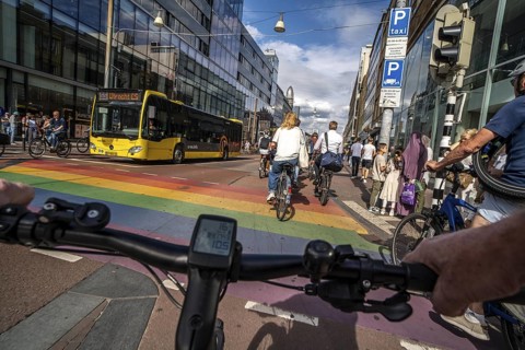 Ride your bike on the central cycle path on Lange Viestraat, Vredenburg, in the city centre of