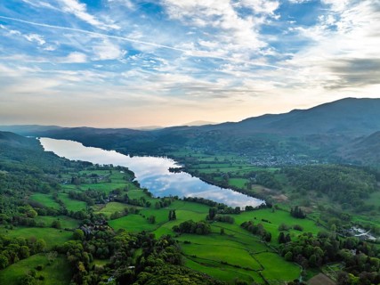 Farms over Coniston Water from drone, Lake District National Park, Cumbria, UK