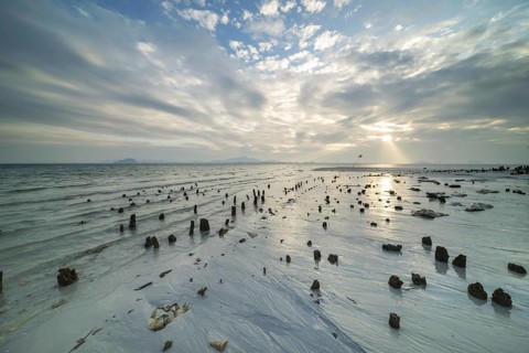 Structures in the sand at sunrise on Sivalai Beach, Koh Mook Island, Satun Province, Southern