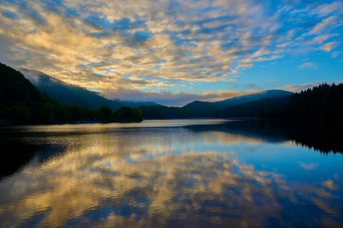 Lake with impressive cloud formations reflected in the water, summer, Rursee, Obersee, Rurberg,