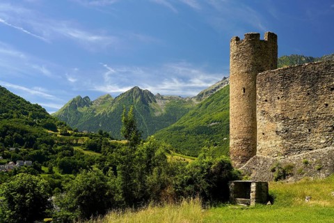 The ruins of the Château Sainte-Marie castle in Esterre and the mountain landscape near
