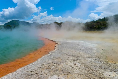 Geothermal pool with steam and a rocky environment, Champagne Pool thermal lake, Wai-O-Tapu Thermal