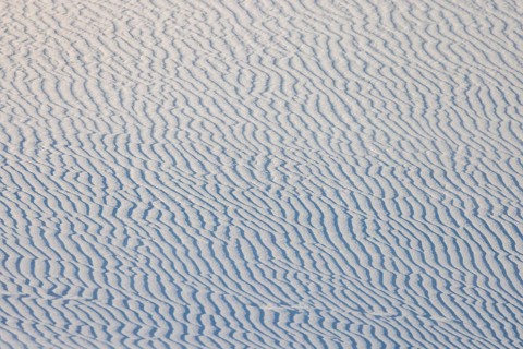 Wind creates wave patterns in the sand dunes at White Sands National Park in Alamogordo, New