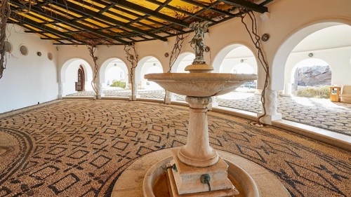 Open atrium with central fountain and detailed mosaic pattern in the floor, Kalithea, Kallithea,