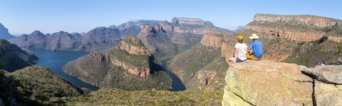 Two hikers enjoying panorama, Blyde River Canyon with Three Rondawels peak, view of gorge with