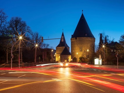Wide Tor tor and Riesling tower at dusk with light traces of cars, part of the medieval town