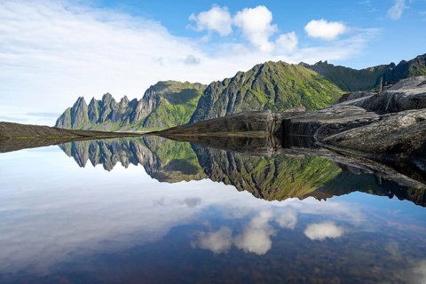 Reflection in a tidal pool, rocky coast of Tungeneset, Devil's Teeth, Okshornan, Ersfjorden, Senja