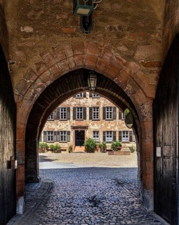 The old castle with Barbarossaplatz and the castle café in the old town centre of Büdingen, Hesse,
