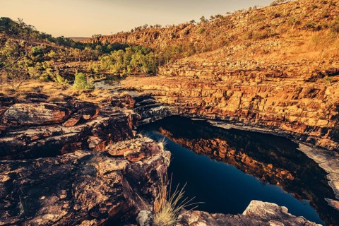 Bell Gorge waterfall, a body of water in north-west Australia in the Kimberley. Sunrise in the