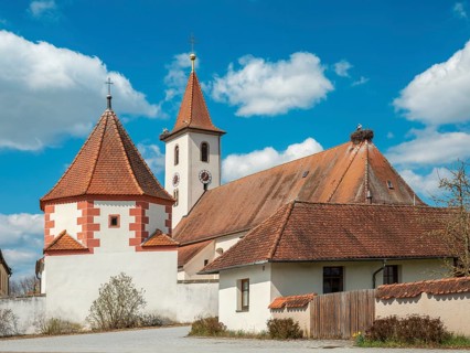 Church of the Visitation of the Virgin Mary in the village of Rauenzell in spring, storks and stork