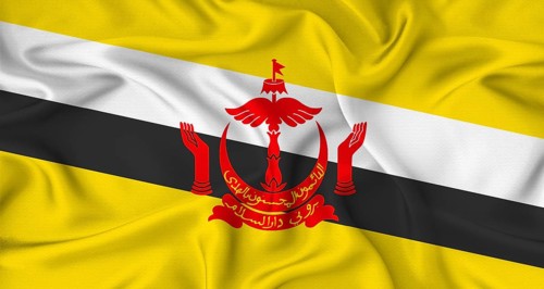 Realistic Brunei flag waving. Close up of flag of Brunei with cloth texture
