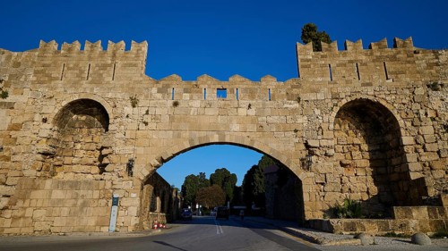 Arsenal Tor, Rhodes city wall, Medieval stone gate with symmetrical arches over the street, harbour