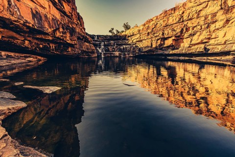 Bell Gorge waterfall, a body of water in north-west Australia in the Kimberley. Sunrise in the