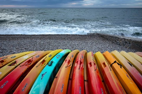 Kayaks, boats, colourful, lying on the beach, pebble beach, Étretat, sea, Normandy, Seine-Maritime,