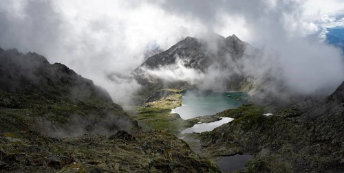 View of mountain landscape with mountain lakes Wangenitzsee and Kreuzsee, cloudy mountain peaks,