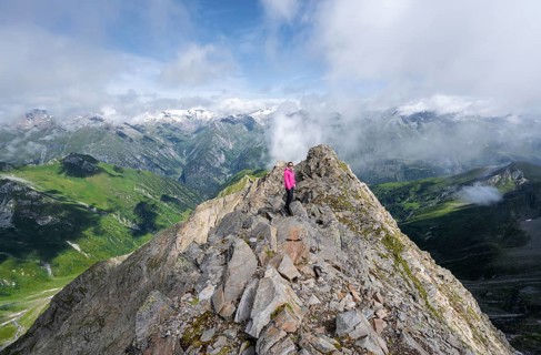 Mountaineer on the summit of the Lasörling, view of the mountain panorama of the Venediger Group,