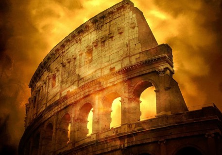 Golden hues light up the Colosseum as it stands majestically against the evening sky. This iconic