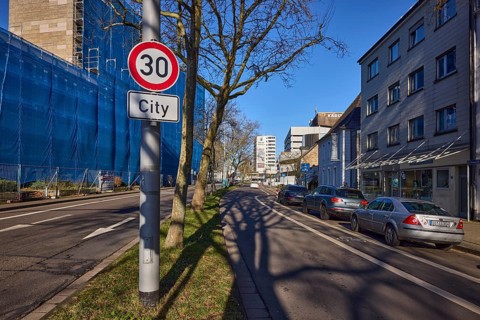 Tempo 30 sign, additional sign City, traffic sign, general development, trees, parking lane with