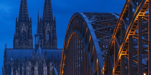 Cologne Cathedral and the Hohenzollern Bridge illuminated with LED lights, Cologne, North