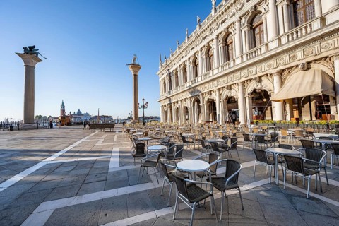 Chairs and tables of cafes at Piazetta San Marco, Colonna di San Marco and Colonna di San Todaro,