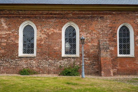Brick façade with window, St Laurentius Church, town church, market, old town, Tönning, North