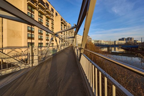 Modern architecture, footbridge, metal railing, river Saar, blue sky, cirrostratus clouds, evening
