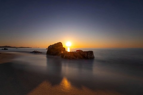 The sun rises on the Costa Rei, a stretch of coastline on the Italian Mediterranean island of
