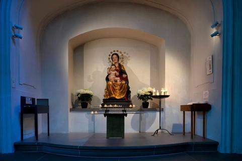 Interior view of the chapel, sacrificial candles, Mary and Jesus, Peter and Paul parish church,