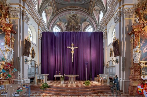 Large purple Lenten cloth in front of the high altar in the baroque parish church of St Nicholas,