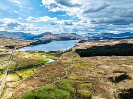 Mountains and Moors over Loch Tulla and River Orchy from a drone, Highlands, Scotland, UK