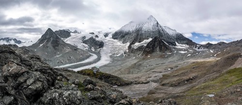 Mountain hut Cabane des Dix in front of glacier Glacier de Cheilon and summit Mont Blanc de