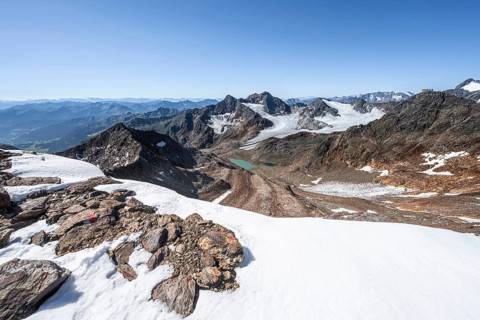 View of mountain basin with blue glacier lakes, behind summit Becher with Becherhaus, glacier